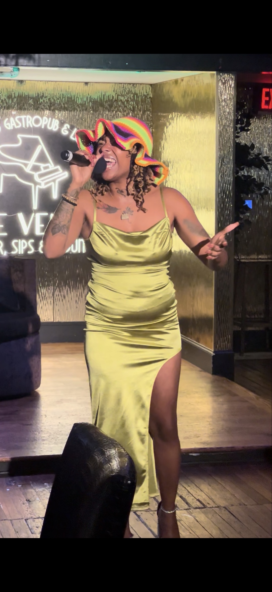 Love Lei performing live in the gold dress